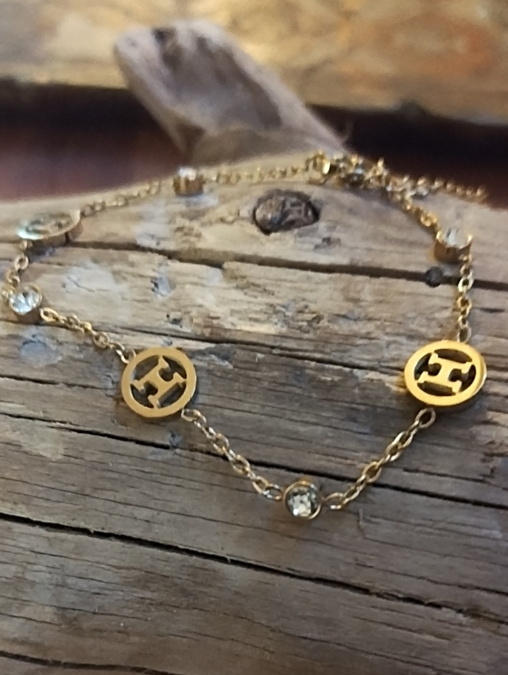 Gold-Tone Logo Disc Link Bracelet with Crystal Accents